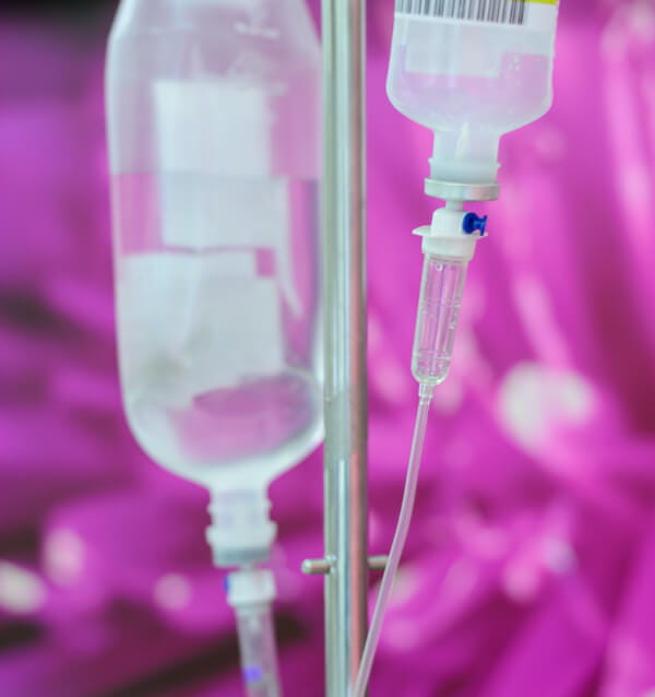 IV bags with pink in the background